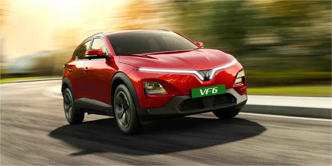 VinFast VF 6 in red driving on an open road